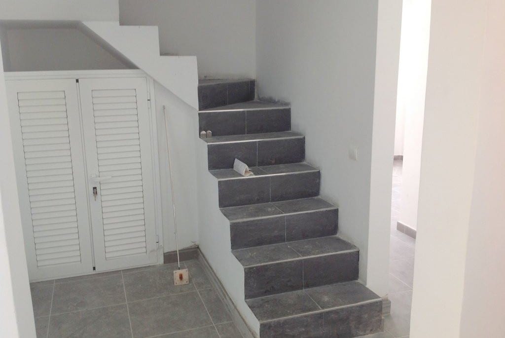 Tiling the stairs at Villa Torres