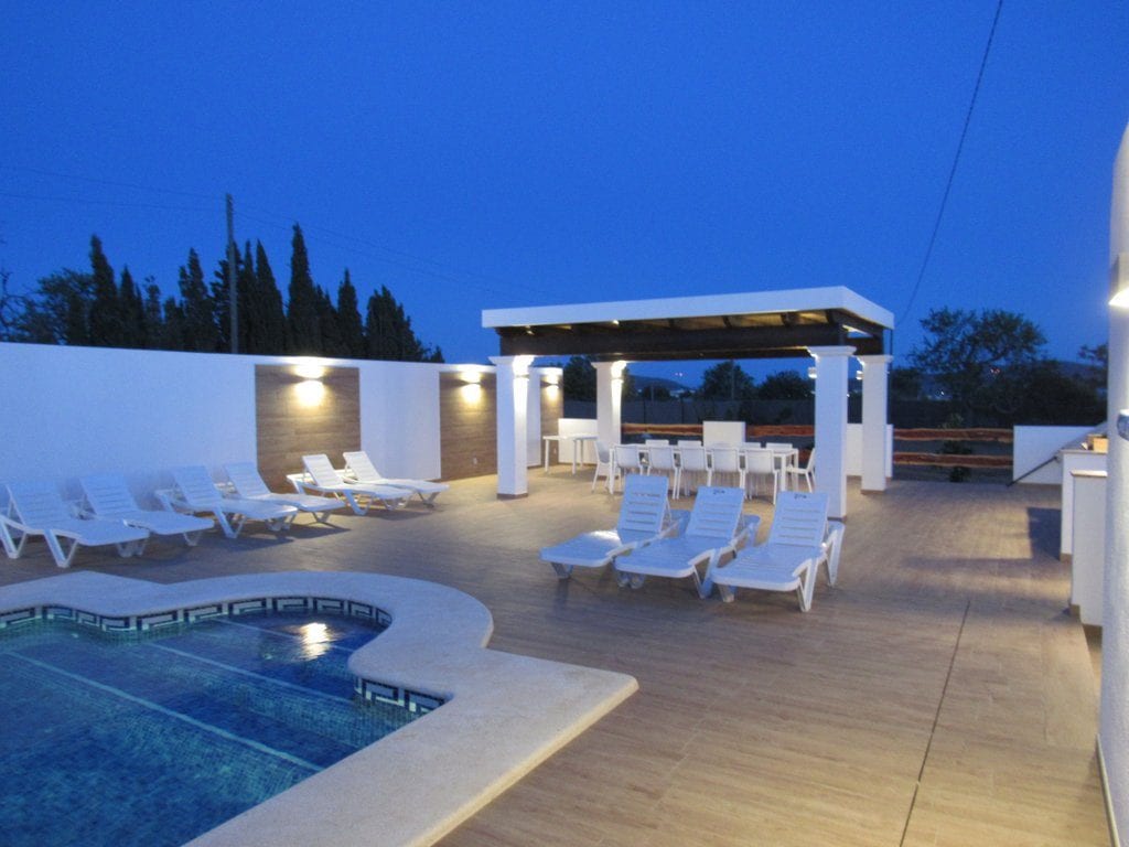 Night shot of pool and terrace